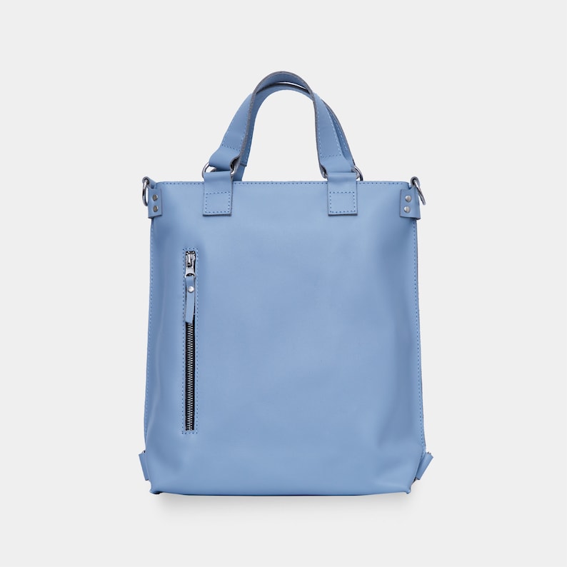 a light blue handbag with a zipper