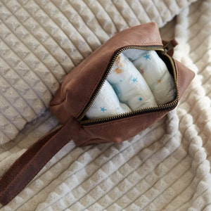 Brown toiletry bag can be used as a diapers pouch