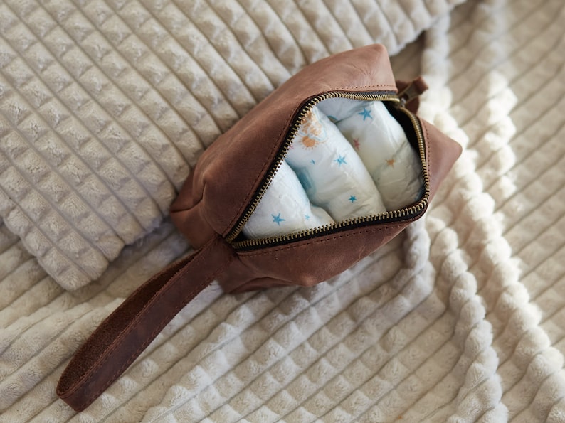 Brown toiletry bag can be used as a diapers pouch