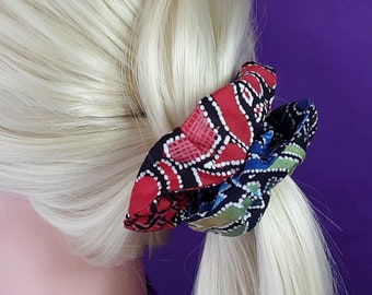 Multicoloured cotton scrunchy. Crisp scrunchie in red, blue, green and yellow on black and white. Lovely, unique gift for teenager or mum.