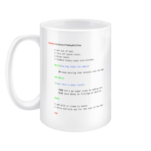 May include: White ceramic mug with a black and green design. The mug features a humorous program code for making tea, with instructions like "Get out of bed", "Turn off alarm clock", and "Stumble bleary eyed into kitchen".