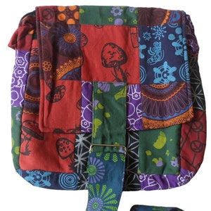 May include: A colourful patchwork fabric shoulder bag with a long strap. The bag is made of different fabrics with various patterns, including mushrooms, flowers, and geometric designs.