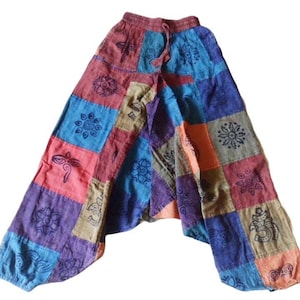 May include: Patchwork trousers with a colourful design featuring various symbols and patterns. The trousers are made of a soft, comfortable fabric and have a drawstring waist.