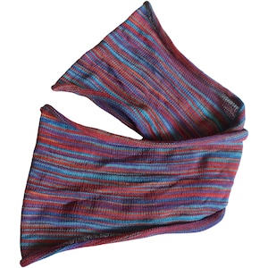 May include: A striped knitted scarf in shades of red, blue and purple. The scarf is made from a soft, lightweight material and is perfect for adding a pop of colour to any outfit.