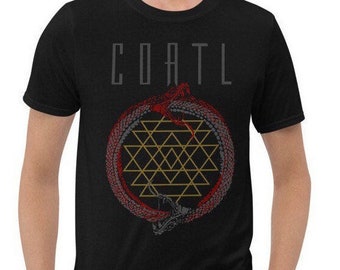 May include: Black t-shirt featuring the word "COATL" in gray block letters above a circular design. The design includes a red and gray serpent encircling a gold geometric pattern. The shirt is short-sleeved.