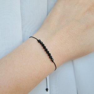 Thin Black tourmaline bracelet on cord, Beaded black tourmaline gemstone jewelry, Minimal black bracelet, Root chakra gemstones
