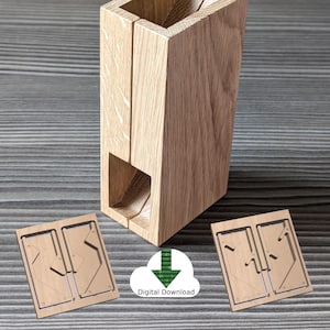 May include: A light oak wooden box with a rectangular aperture at the top and a slot at the bottom. Two wooden cutouts are at the bottom of the image. The text "Digital Download" is in the image.