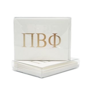 May include: A stack of white note cards with gold foil lettering that reads "&Pi;&Beta;&Phi;". The cards are in a clear plastic box.