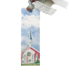 May include: A bookmark featuring a watercolor painting of a red church with a white steeple and a green lawn. The bookmark is decorated with a blue, green, and white ribbon.