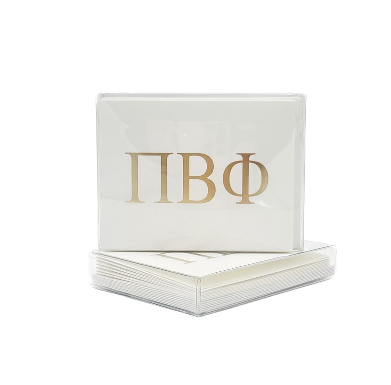 May include: A stack of white note cards with gold foil lettering that reads "&Pi;&Beta;&Phi;". The cards are in a clear plastic box.