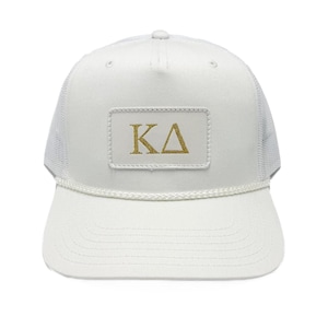 May include: A set of three ceramic mugs with a speckled, matte finish. The mugs are in shades of cream, light grey, and dark grey. Each mug has a simple, minimalist design, ideal for coffee or tea.