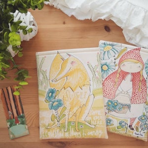 May include: Two book covers with illustrated designs. The first cover features a yellow fox with the text "Sweet" and "Because it has to carry". The second cover features a girl in a red hooded cloak with a basket of flowers and the text "Come on here".