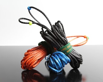 May include: Three spools of rope in black, orange, and blue. The spools are tied together with green bands that say "HBC OUTDOORS" and "BIKINI BOTTOM".