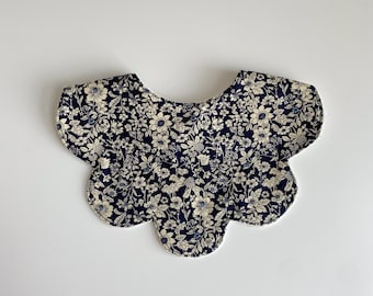 Navy floral scalloped edge bib