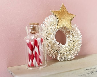 Mini glass jar of Christmas candy canes for modern dollhouse.