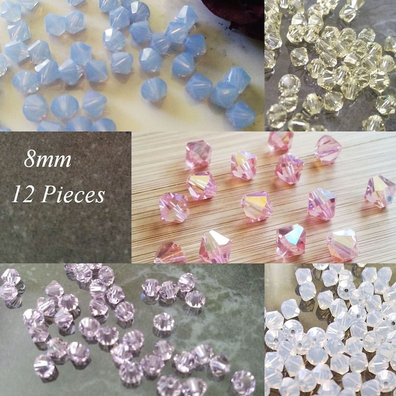 May include: Assortment of 12 8mm crystal beads in various colors, including light blue, pink, and clear. The beads have a faceted, diamond-like shape.