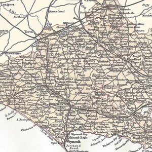 May include: Vintage map showing towns and roads, including Dorchester and Weymouth. The map has a faded appearance, with place names and detailed cartography.