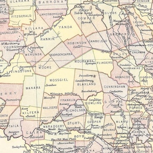 May include: A detailed vintage map of an Australian region, with numerous place names in a serif font. The map is colored in shades of beige, pink, and brown, with rivers and geographical features indicated.
