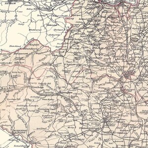 May include: Vintage map of a region, with detailed roads, towns, and geographical features. The map uses sepia tones and black lines, giving it a classic look. Text labels identify locations, creating a historical document.