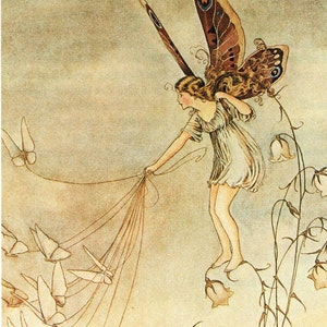 May include: A fairy with brown hair and a white dress is holding strings attached to a group of white butterflies. She is standing on a flower with a brown and blue butterfly on her back. The background is a light brown.