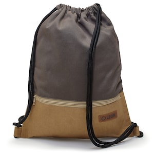 May include: A gray and brown drawstring backpack with a zippered pocket and a brown leather patch with the word "LEON" on it.