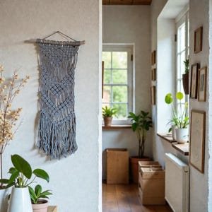 May include: A gray macrame wall hanging with a geometric design is displayed on a white wall. The handmade textile art piece is suspended from a wooden dowel and metal hanger. The room features plants and natural light.