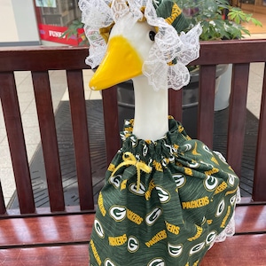 Green Bay Packers print fabric for Large Goose dresses Cement or Plastic Goose I have a variety of fabric of Green Bay Packers this dress wi