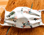 Cactus blossom floral print aqua and cold paint spatter print reversible 100 Cotton face mask. Cute looking, handmade and washable.