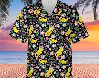 May include: A black short-sleeved button-up shirt with a tropical print featuring yellow tubas, pink, blue, and green flowers, and green leaves on a black background.