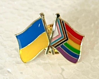 The #SlavaUkraini LGBTQ + POC Progress Pride Rainbow and Ukraine National Flag Double Pin Badge