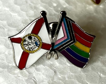 The “DeSantis #SayGayAllDay” LGBTQ + POC Progress Pride Double Rainbow and Florida State Flag Pin Badge