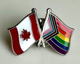 The “Great Rainbow North” LGBTQ + POC Progress Pride and Canada National Maple Leaf Double Flag Pin Badge