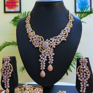 Gold-Ruffle Glam 4-Piece Jewelry Set - Necklace, Earrings, Bracelet, and Ring