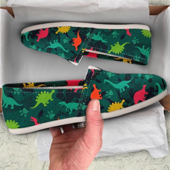 toms dinosaur slip ons