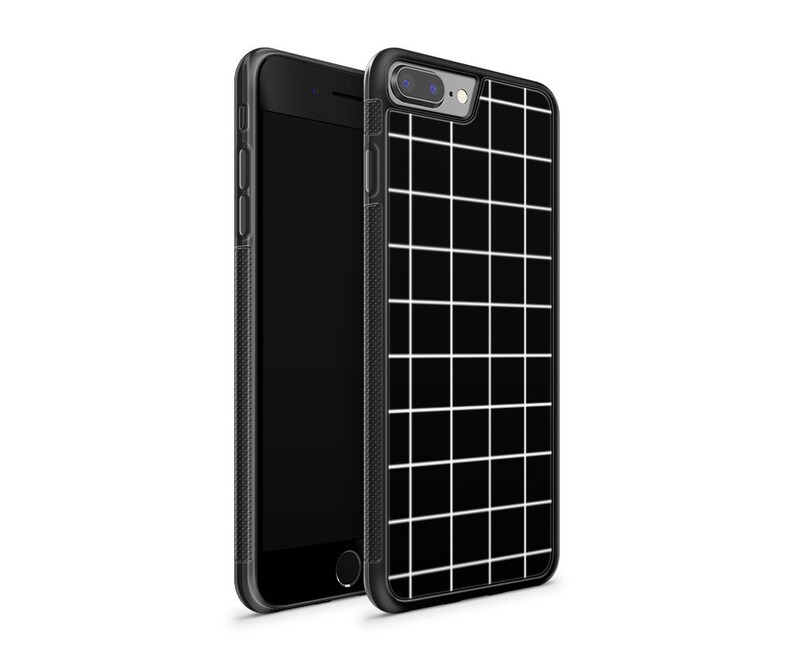 May include: Black phone case with a white grid pattern.