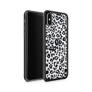 May include: Black and white leopard print phone case for an iPhone X. The case is made of clear, hard plastic and has a black border.