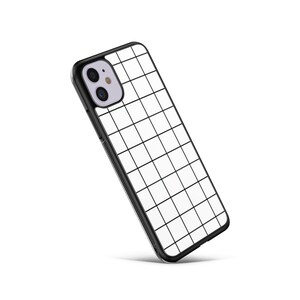 May include: A black phone case with a white grid pattern. The case has a cutout for the camera lens.
