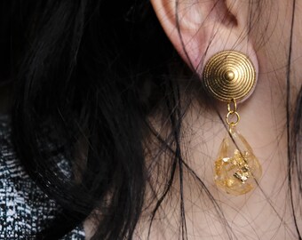 Purple earrings and gold leaf