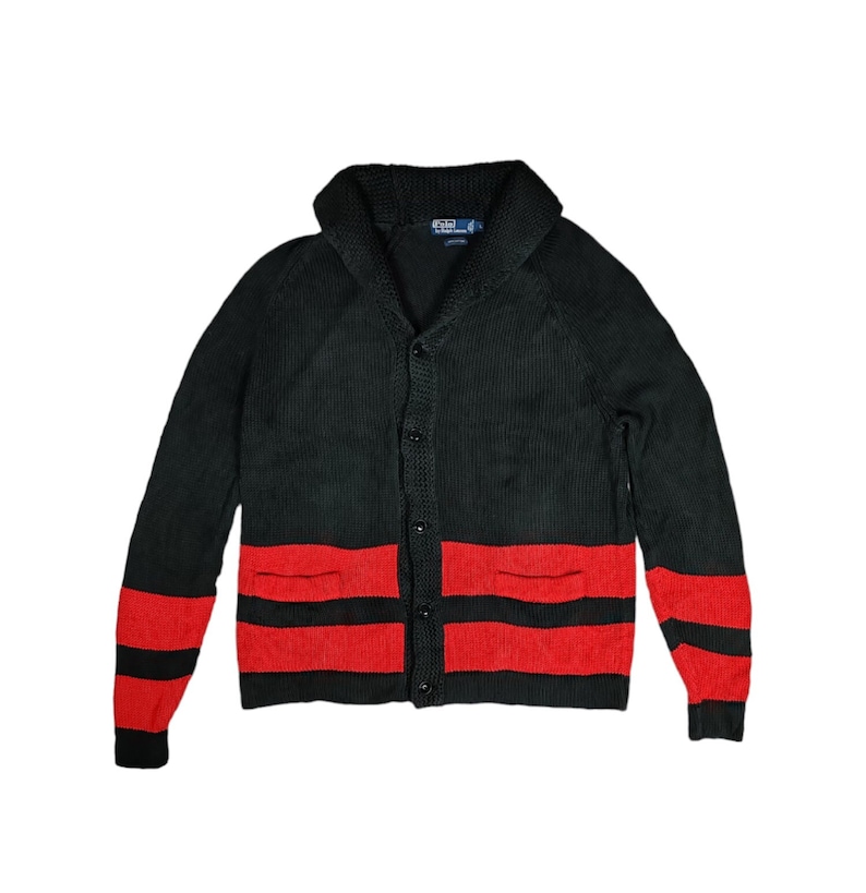 May include: Black and red striped cardigan with a shawl collar and button fastening. The cardigan has two pockets on the front.
