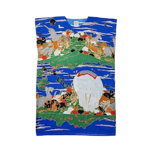 May include: A blue sleeveless dress featuring a colourful print of various animals, including an elephant, tiger, and birds. The dress has a round neckline and a loose fit.