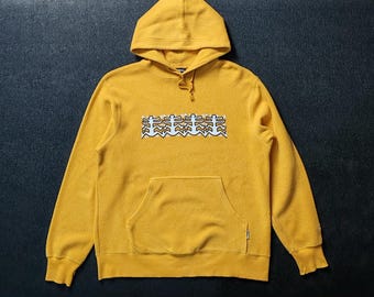 Suéter con capucha de polar vintage de Keith Haring, talla mediana, suéter amarillo clásico con pintura pop art de Keith Haring