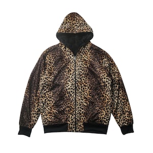 May include: A brown and black leopard print hooded jacket with a zipper closure.