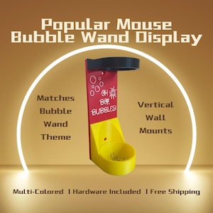 May include: A yellow and red bubble wand display with the text "Popular Mouse Bubble Wand Display." The display has a circular top and a bowl-shaped base. The text "OH BOP BUBBLES!" is printed on the red section.