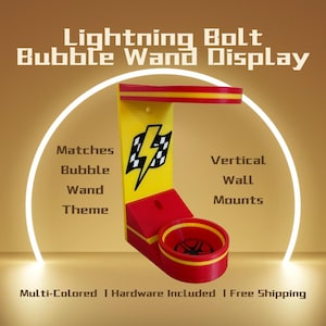May include: A multi-colored Lightning Bolt Bubble Wand Display. The display is yellow and red, with a lightning bolt graphic. The text on the display reads "Matches Bubble Wand Theme" and "Vertical Wall Mounts."