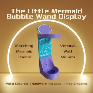 May include: A multi-colored, vertical bubble wand display in purple and teal, with the text "Life is the Bubbles." The display is designed with a mermaid theme and includes hardware for wall mounting.