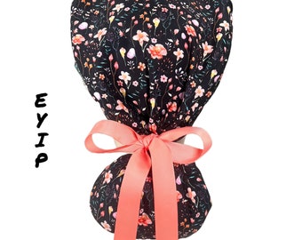 Floral ponytail scrub cap for women by EYIP, mini flowers on black surgical cap, peach ribbon & clear buttons