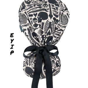 Ponytail scrub cap, ponytail scrub hat, radiology scrub cap, EYIP scrub cap, skulls and bones surgical scrub cap for women