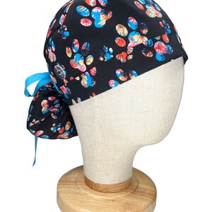 Ponytail Scrub Cap for Women by EYIP, Dog Paws Surgical Cap, Blue Ribbon & Clear Buttons image 2