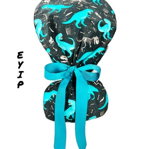 Ponytail Scrub Cap for Women by EYIP, Dinosaurs Surgical Cap, Blue Ribbon & Clear Buttons