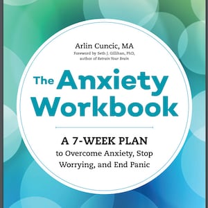 May include: Book cover with a blue and green background featuring a white circle with the title "The Anxiety Workbook: A 7-Week Plan to Overcome Anxiety, Stop Worrying, and End Panic".